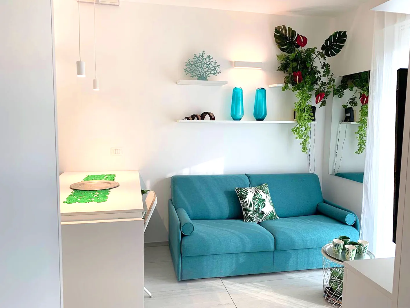 Natural light and marine tones dance together: Suite Jesolo's living room reveals the perfect balance between design and nature.
